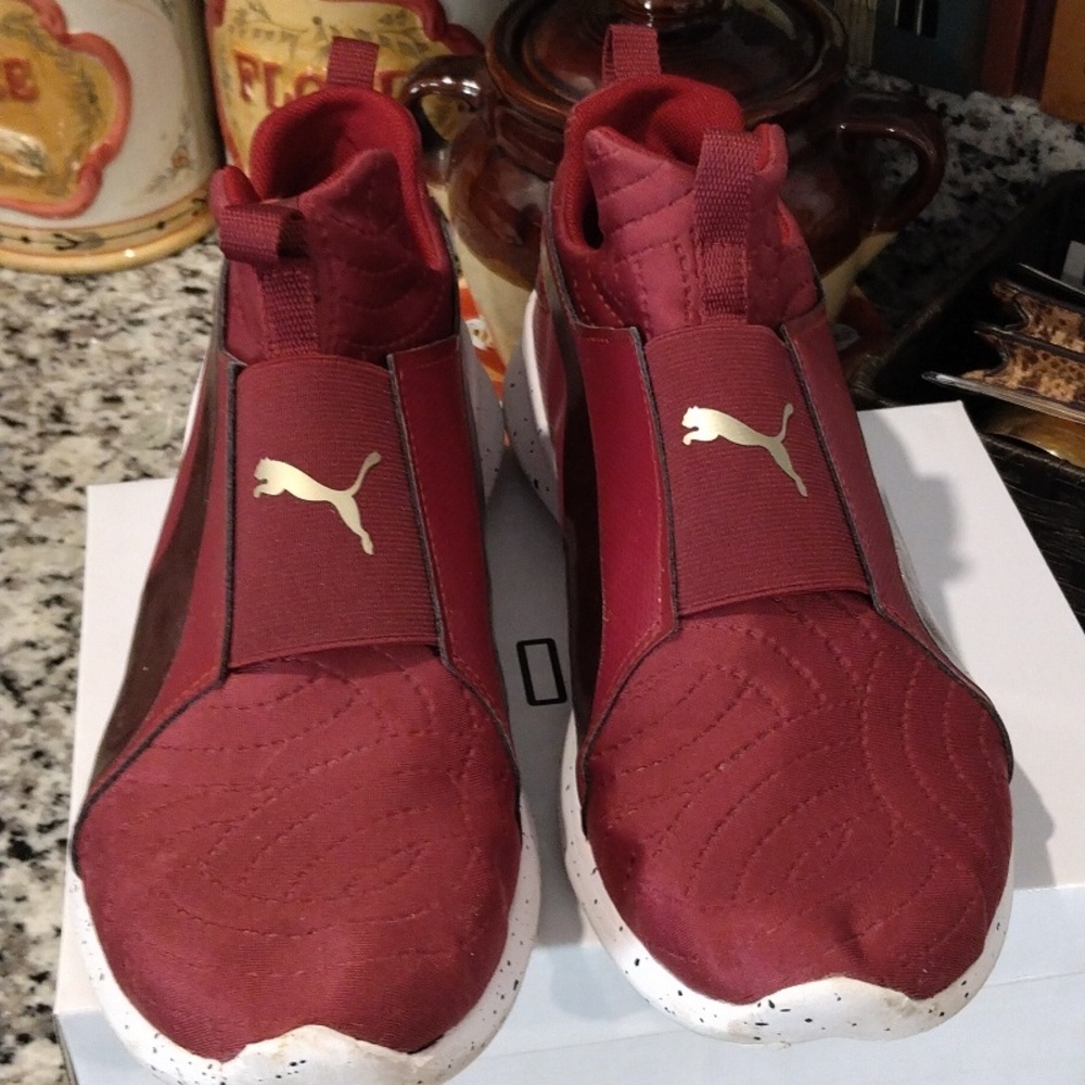 Burgundy Pumas sneakers